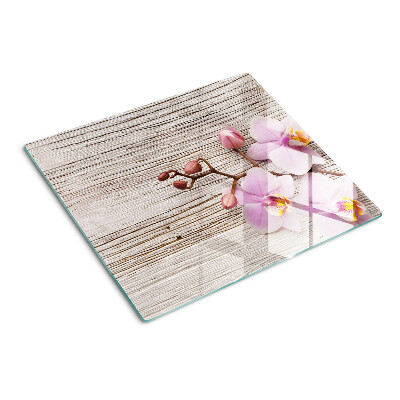 Tagliere in vetro Orchidee su uno sfondo di legno