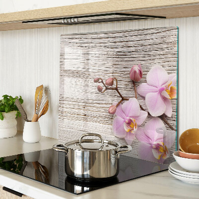 Tagliere in vetro Orchidee su uno sfondo di legno