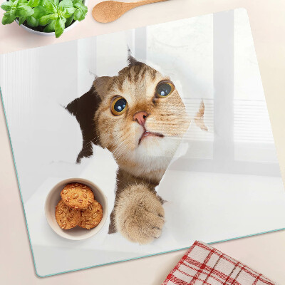 Tagliere in vetro temperato Un gatto che guarda attraverso un buco nel muro