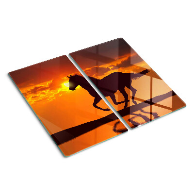 Tagliere in vetro Un cavallo sullo sfondo del sole al tramonto