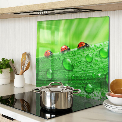 Tagliere in vetro Coccinelle su sfondo verde
