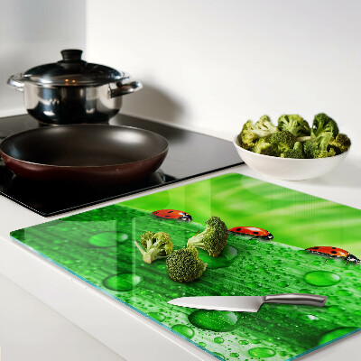 Tagliere in vetro Coccinelle su sfondo verde