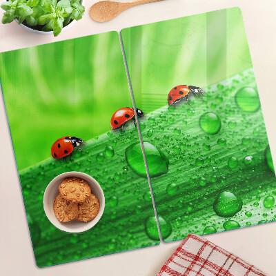 Tagliere in vetro Coccinelle su sfondo verde