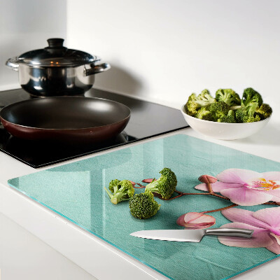 Tagliere in vetro temperato Orchidee su sfondo blu