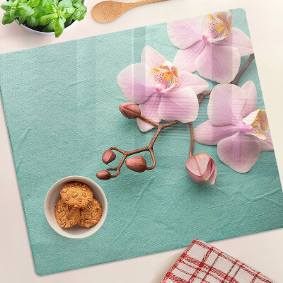 Tagliere in vetro temperato Orchidee su sfondo blu