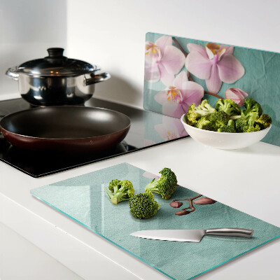 Tagliere in vetro temperato Orchidee su sfondo blu