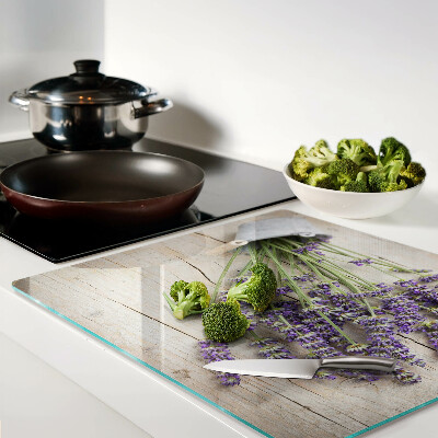 Tagliere in vetro Lavanda in vaso su fondo in legno