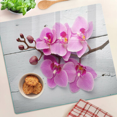 Tagliere in vetro Orchidee su sfondo bianco