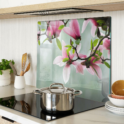 Tagliere in vetro temperato Fiori di magnolia su uno sfondo di verde