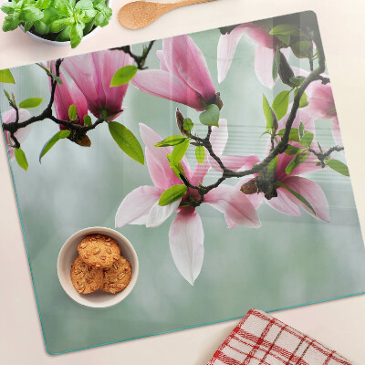 Tagliere in vetro temperato Fiori di magnolia su uno sfondo di verde