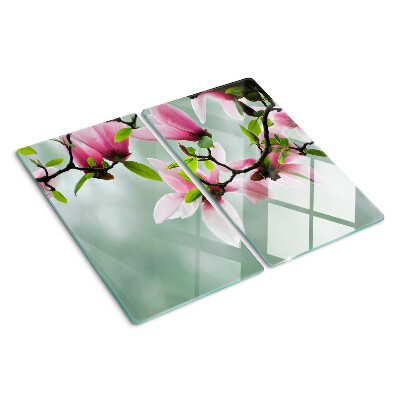 Tagliere in vetro temperato Fiori di magnolia su uno sfondo di verde