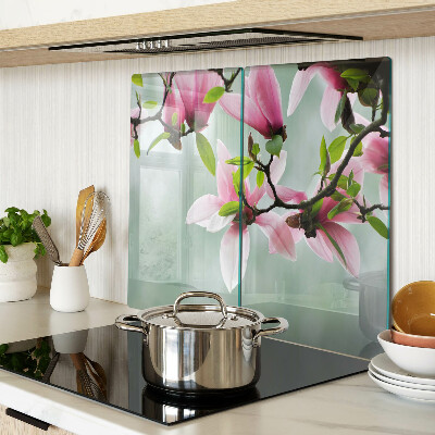 Tagliere in vetro temperato Fiori di magnolia su uno sfondo di verde