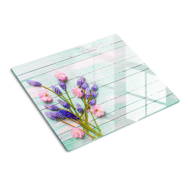 Tagliere in vetro Fiori su uno sfondo di legno