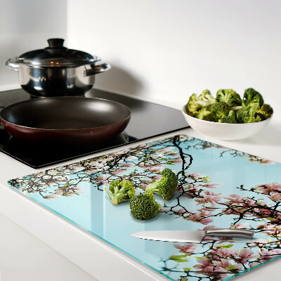 Tagliere in vetro temperato Fiori di magnolia su sfondo blu