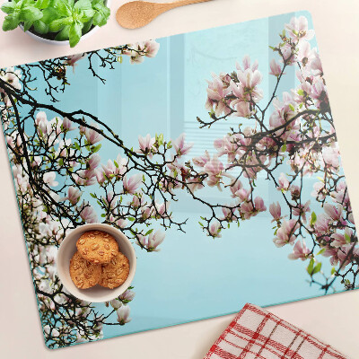 Tagliere in vetro temperato Fiori di magnolia su sfondo blu