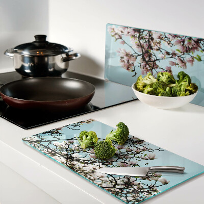 Tagliere in vetro temperato Fiori di magnolia su sfondo blu