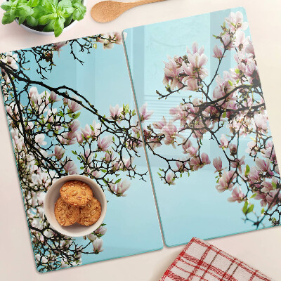Tagliere in vetro temperato Fiori di magnolia su sfondo blu