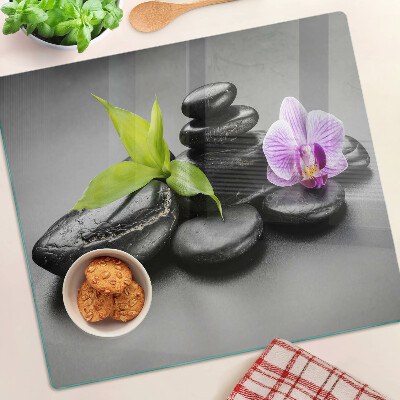 Tagliere in vetro temperato Pietre e orchidea sullo sfondo