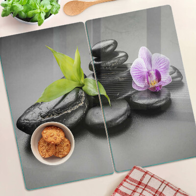 Tagliere in vetro temperato Pietre e orchidea sullo sfondo