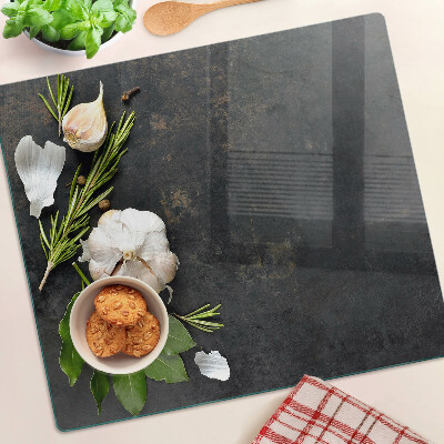Tagliere in vetro Fiori ed erbe su uno sfondo di marmo