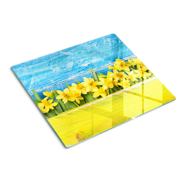 Tagliere in vetro temperato Fiori di narciso contro il cielo
