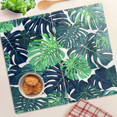 Tagliere in vetro temperato Foglie di monstera su uno sfondo tropicale
