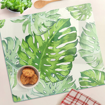 Tagliere in vetro temperato Foglie di Monstera su uno sfondo chiaro