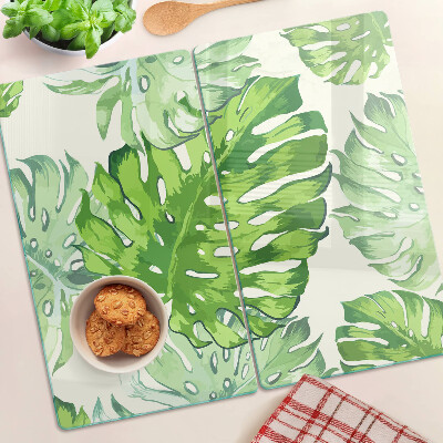 Tagliere in vetro temperato Foglie di Monstera su uno sfondo chiaro