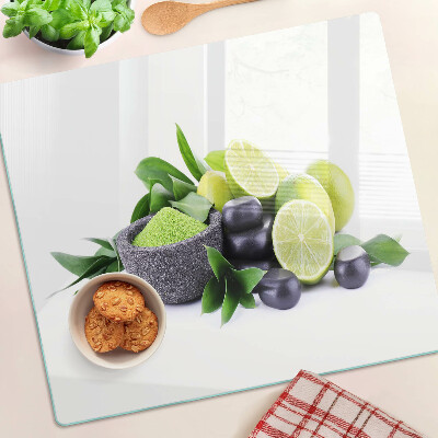 Tagliere in vetro Limoni e uva su sfondo verde