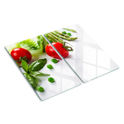 Tagliere in vetro Verdure su un piano di lavoro bianco