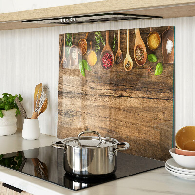 Tagliere in vetro temperato Spezie ed erbe aromatiche su fondo in legno
