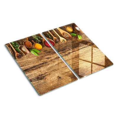 Tagliere in vetro temperato Spezie ed erbe aromatiche su fondo in legno
