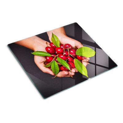 Tagliere in vetro Ciliegie rosse nelle mani