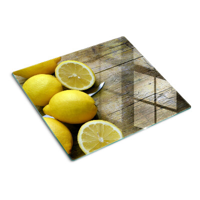 Tagliere in vetro Limoni su uno sfondo di legno