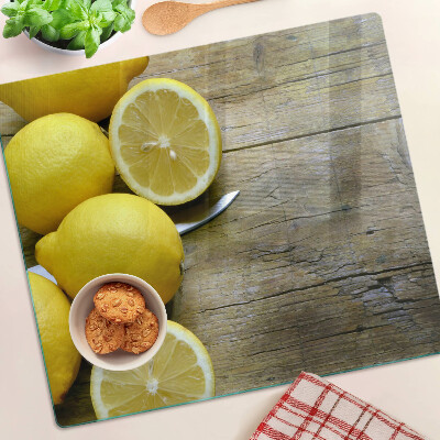 Tagliere in vetro Limoni su uno sfondo di legno