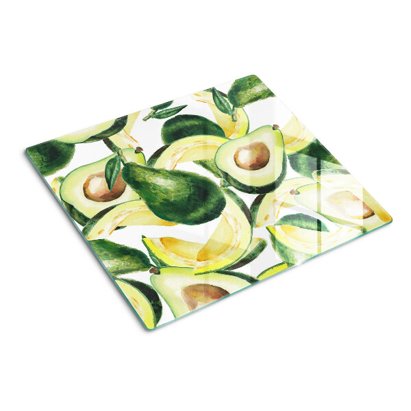 Tagliere in vetro temperato Avocado su uno sfondo di foglie