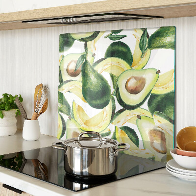 Tagliere in vetro temperato Avocado su uno sfondo di foglie