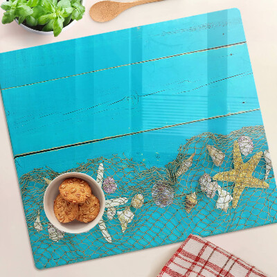 Tagliere in vetro Conchiglie e stelle marine in una rete
