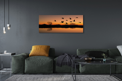 Quadro su tela Sunset di uccelli volanti