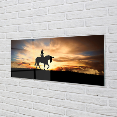 Quadro su vetro Donna su un unicorno al tramonto