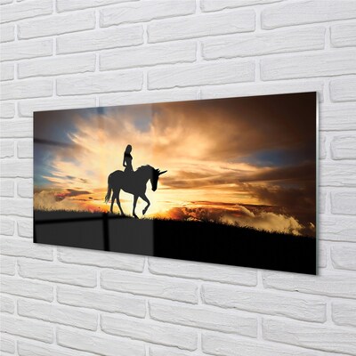 Quadro su vetro Donna su un unicorno al tramonto