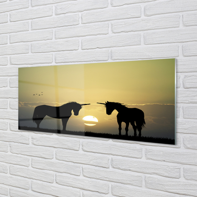 Quadro vetro Campo di unicorni al tramonto