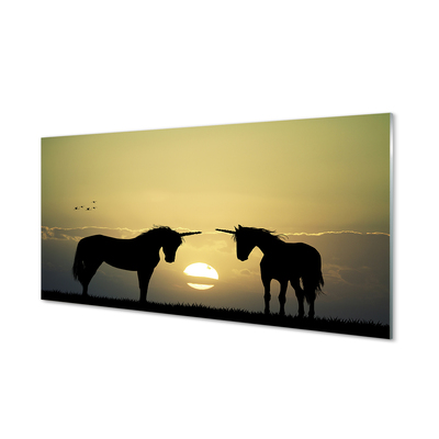 Quadro vetro Campo di unicorni al tramonto