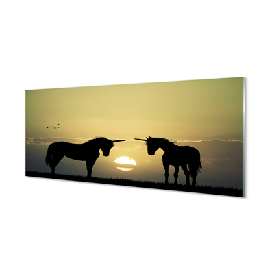 Quadro vetro Campo di unicorni al tramonto