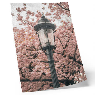 Stampa su tela Alberi rosa, lanterne nere, atmosfera nostalgica
