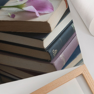 Stampa su tela Una pila di libri con un fiore delicato in cima