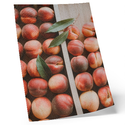 Poster Pesche con foglie in una scatola di legno