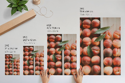Poster Pesche con foglie in una scatola di legno