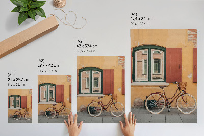 Stampa su tela Una bicicletta sullo sfondo di una colorata facciata retrò.