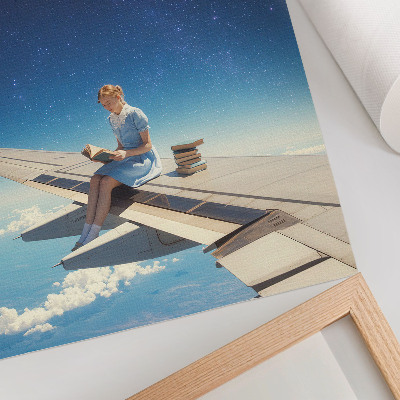 Foto su tela Libri dell'universo della ragazza sull'ala di un aereo